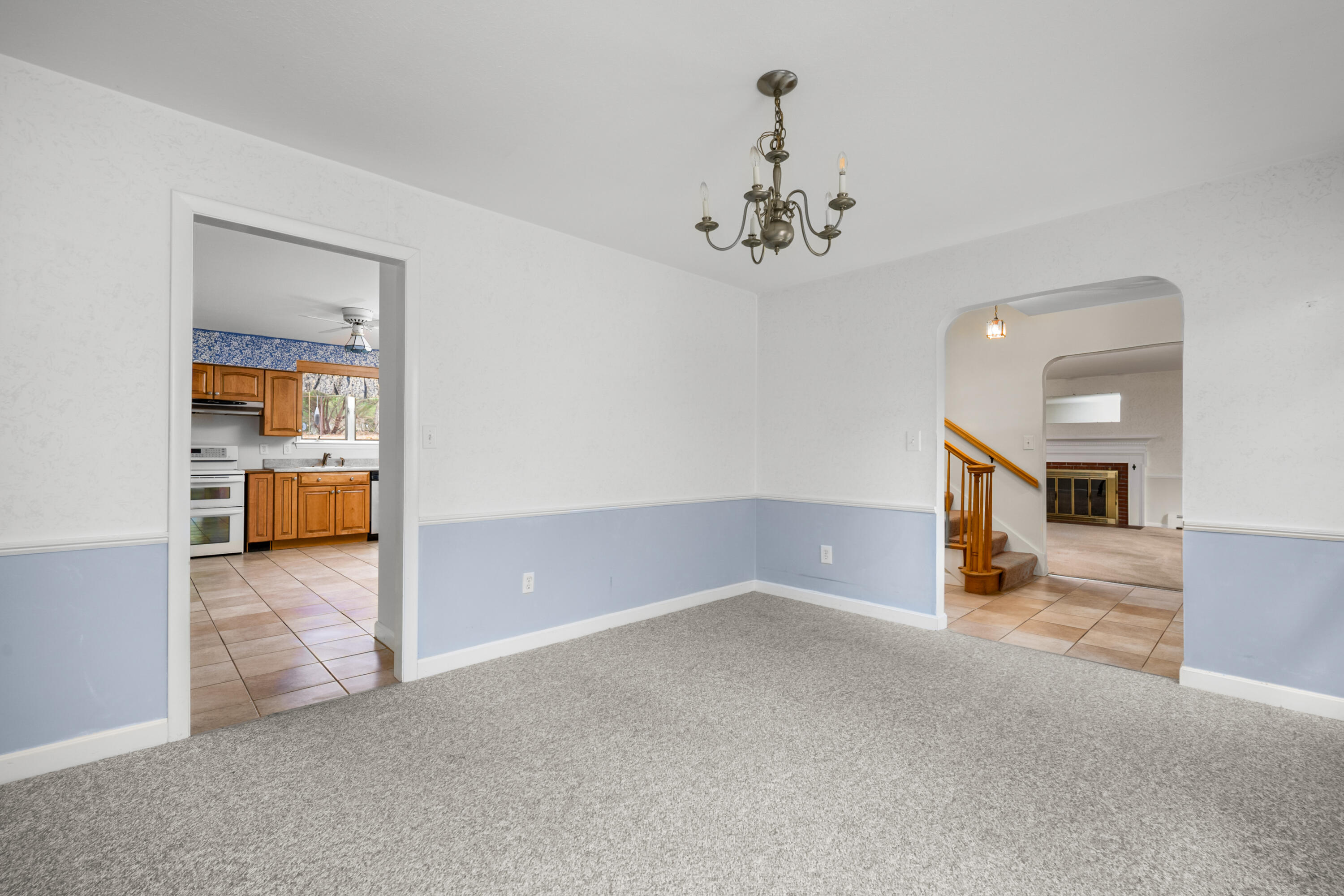 33 Head Of The Bay Road Buzzards Bay, MA 02532 - Photo 11 of 46 a view of a livingroom with a chandelier