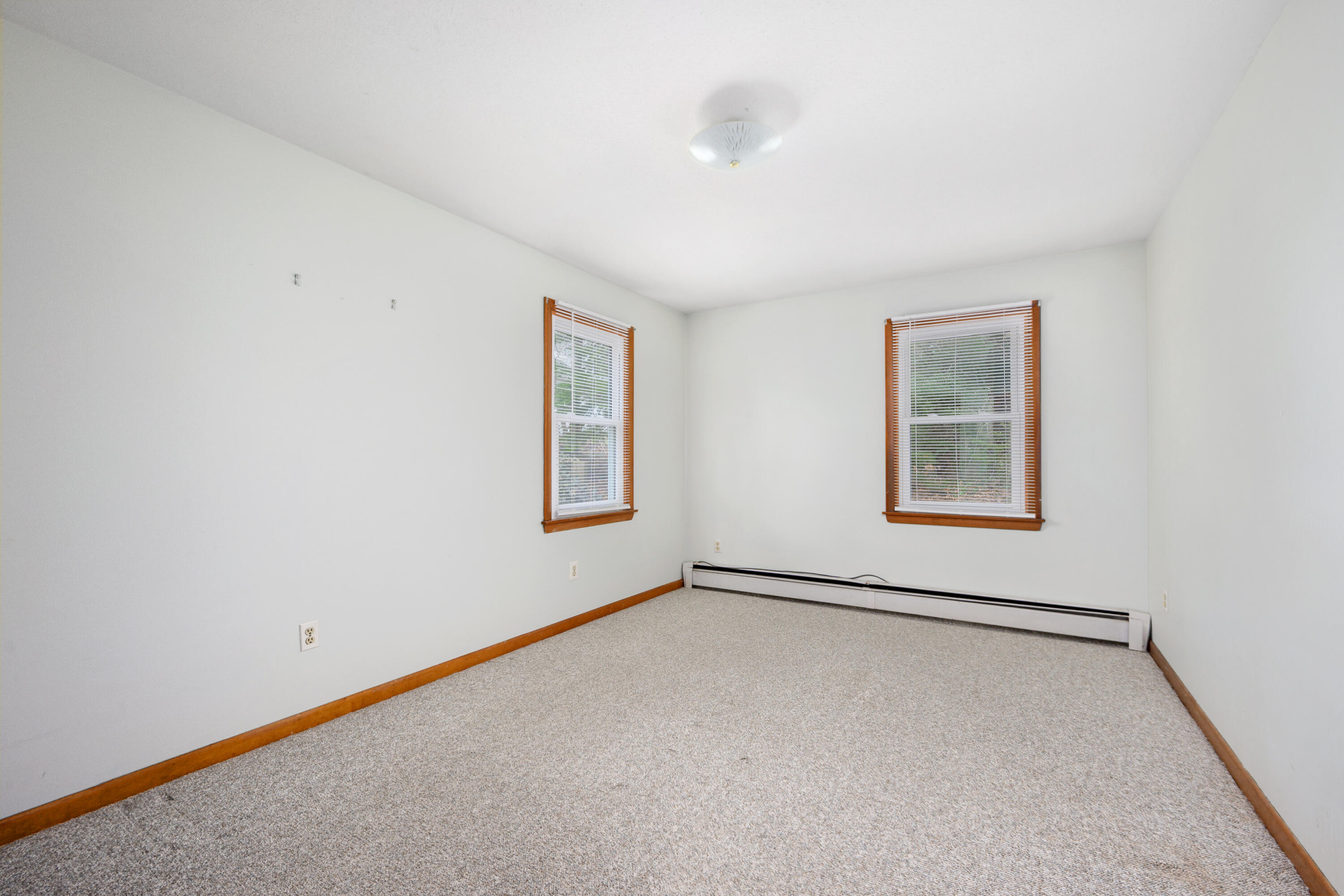 33 Head Of The Bay Road Buzzards Bay, MA 02532 - Photo 15 of 46 an empty room with windows