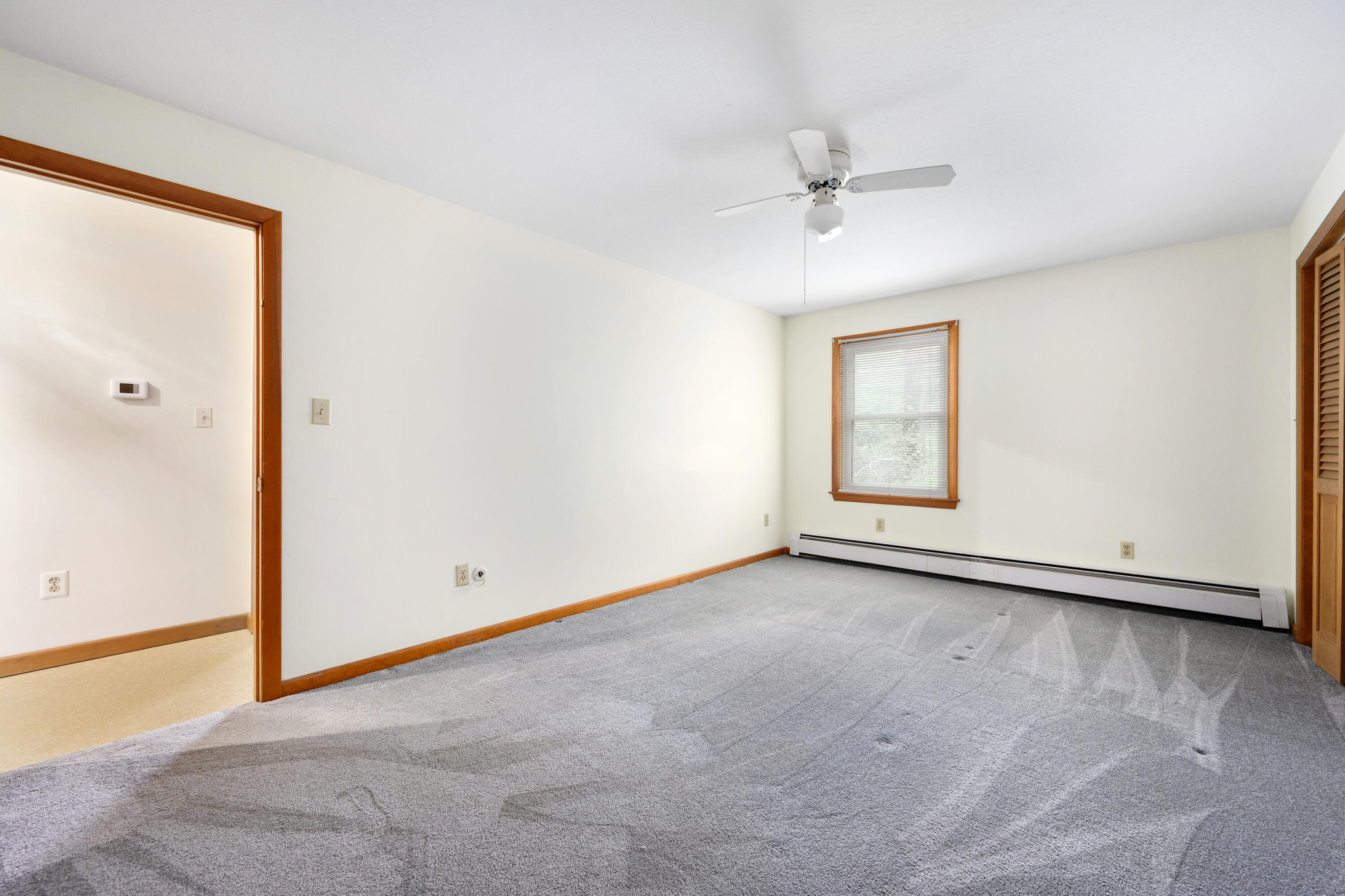 33 Head Of The Bay Road Buzzards Bay, MA 02532 - Photo 25 of 46 an empty room with a ceiling fan and a window