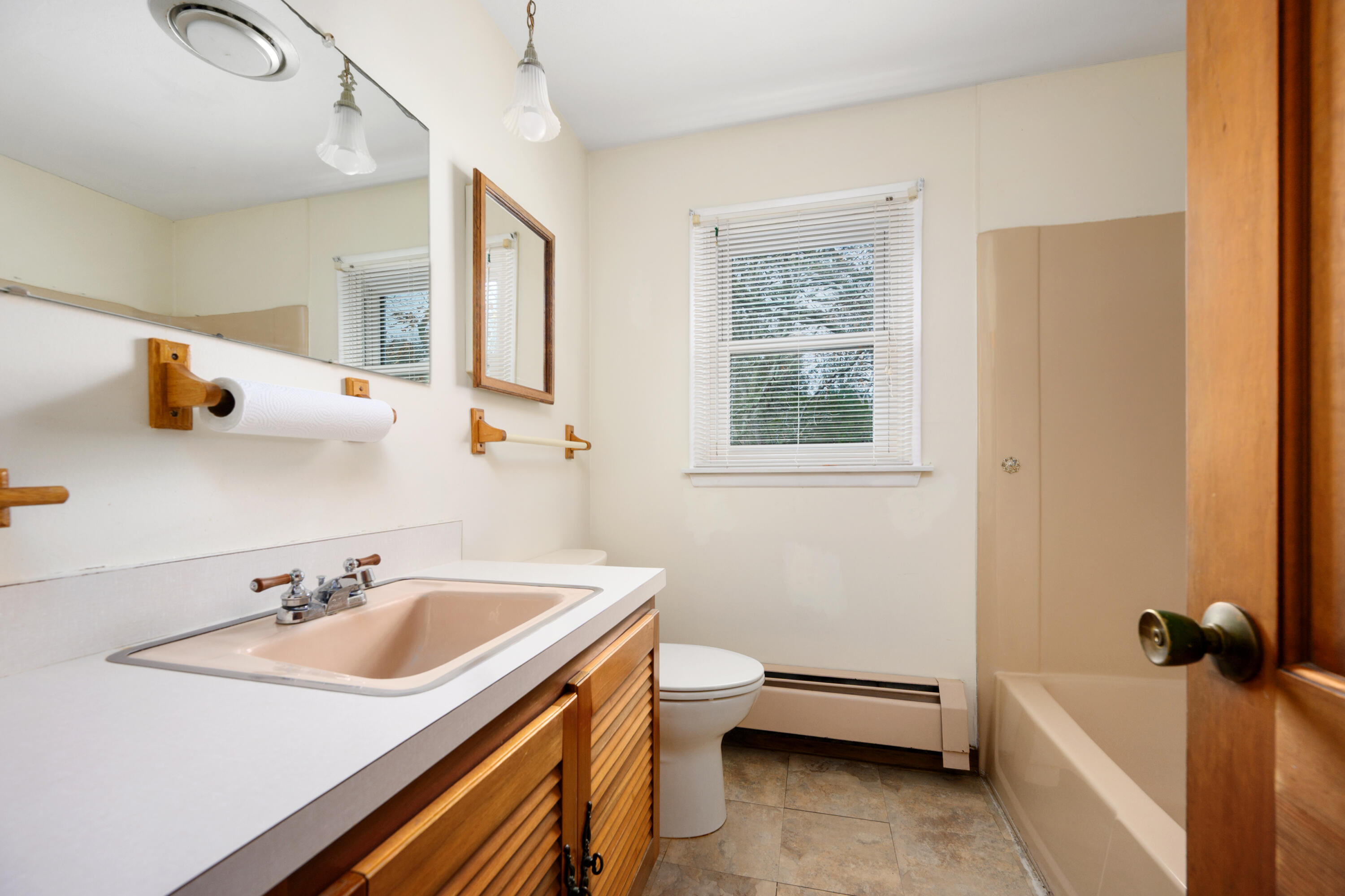 33 Head Of The Bay Road Buzzards Bay, MA 02532 - Photo 28 of 46 a bathroom with a sink and a bathtub