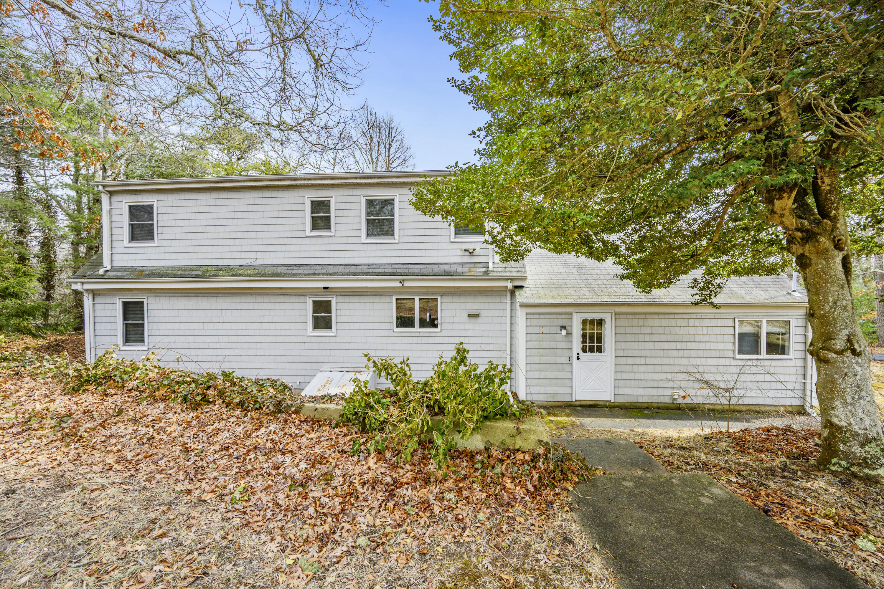 33 Head Of The Bay Road Buzzards Bay, MA 02532 - Photo 39 of 46 front view of a house with a large tree