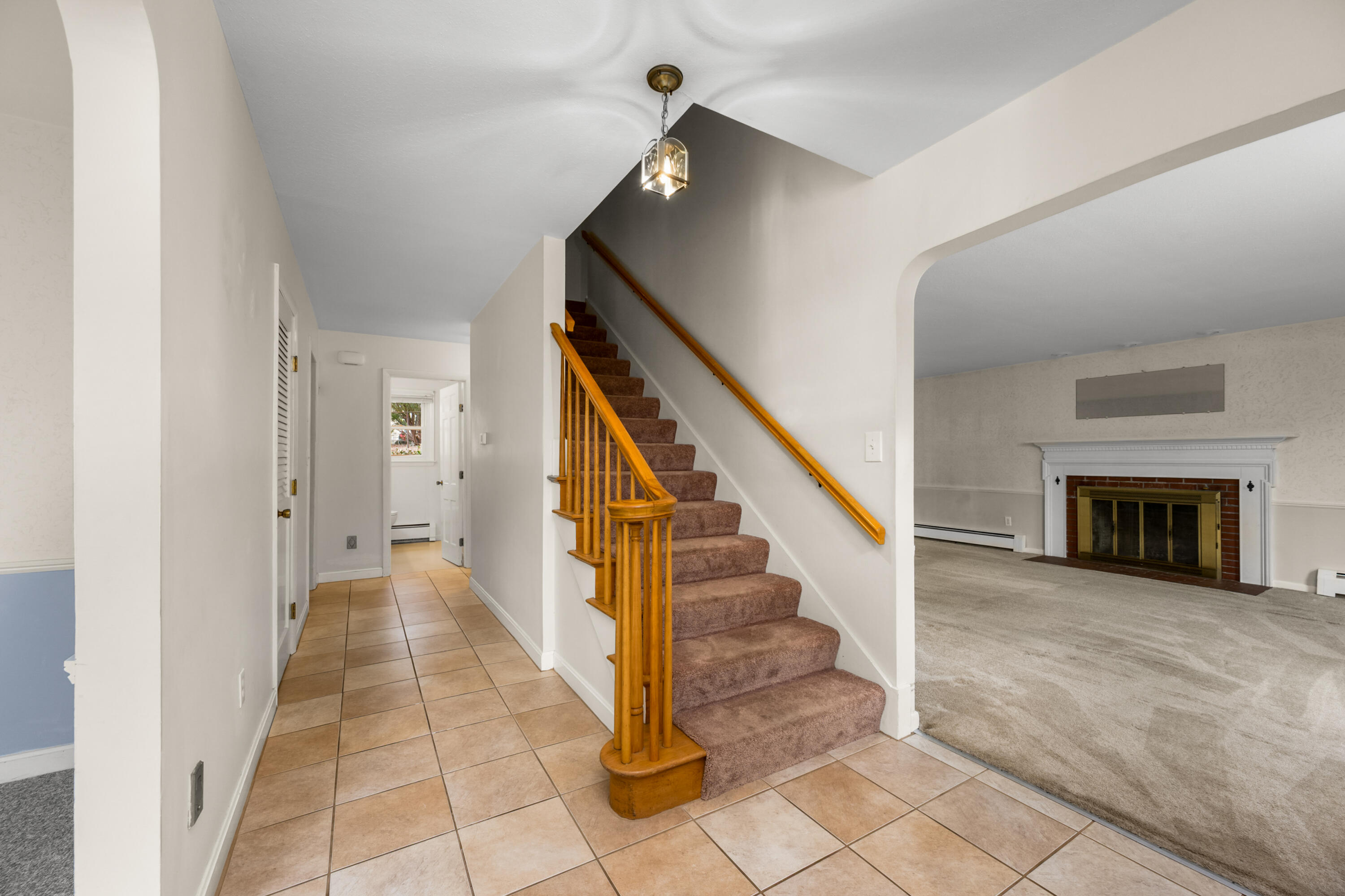 33 Head Of The Bay Road Buzzards Bay, MA 02532 - Photo 6 of 46 a view of a hallway with wooden floor and staircase