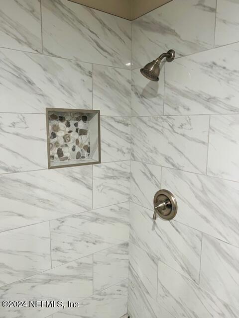 955 Registry Boulevard, Unit 210 St. Augustine, FL 32092 - Photo 17 of 31 a bathroom with a shower