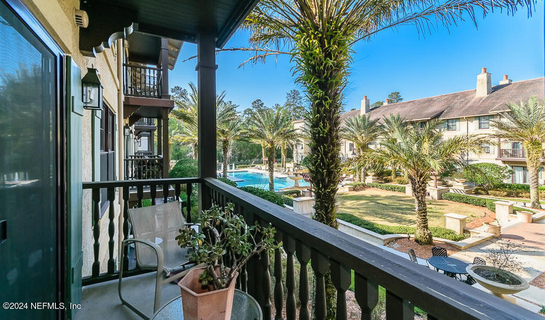 955 Registry Boulevard, Unit 210 St. Augustine, FL 32092 - Photo 8 of 31 a view of a balcony with potted plants
