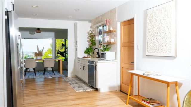 a view of living room with furniture and floor to ceiling window