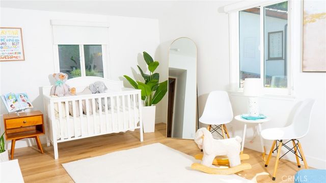 a bedroom with furniture and a window