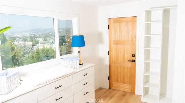 a bathroom with a sink mirror and a shower