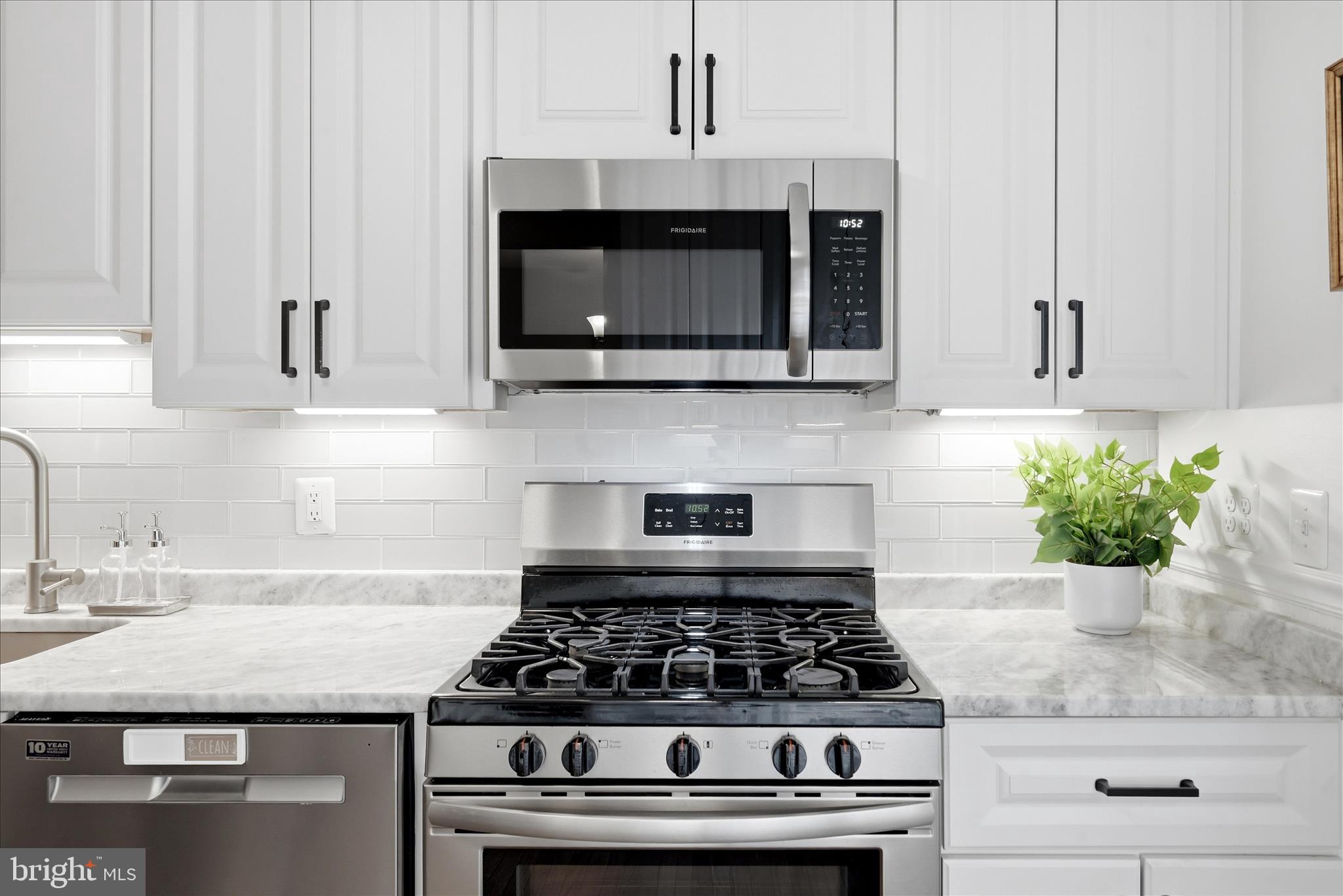 5446 Lighthouse Lane Burke, VA 22015 - Photo 7 of 36 a stove top oven sitting inside of a kitchen