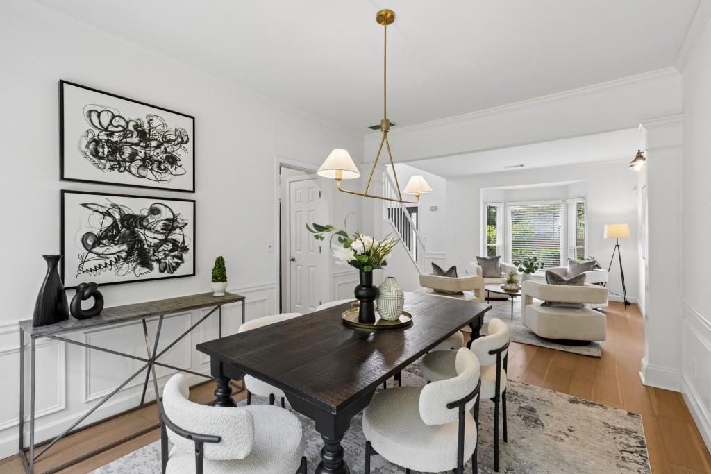 2120 Traywick Chase Alpharetta, GA 30004 - Photo 10 of 54 a view of a dining room with furniture wooden floor and a chandelier