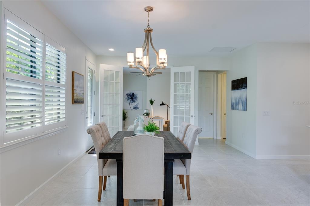 12209 Marsh Pointe Road Sarasota, FL 34238 - Photo 7 of 42 Paneled Glass Doors to Bonus Room