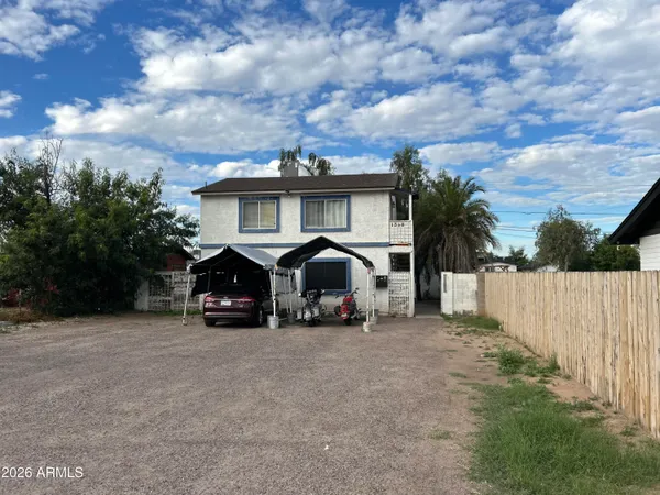 a view of a car parked in front of house