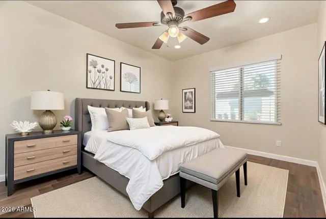 a bedroom with a bed and a table