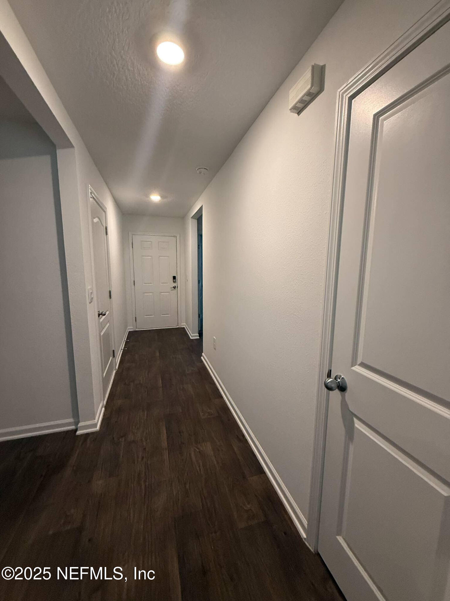 65183 Forest Glen Lane Yulee, FL 32097 - Photo 15 of 44 a view of hallway with wooden floor