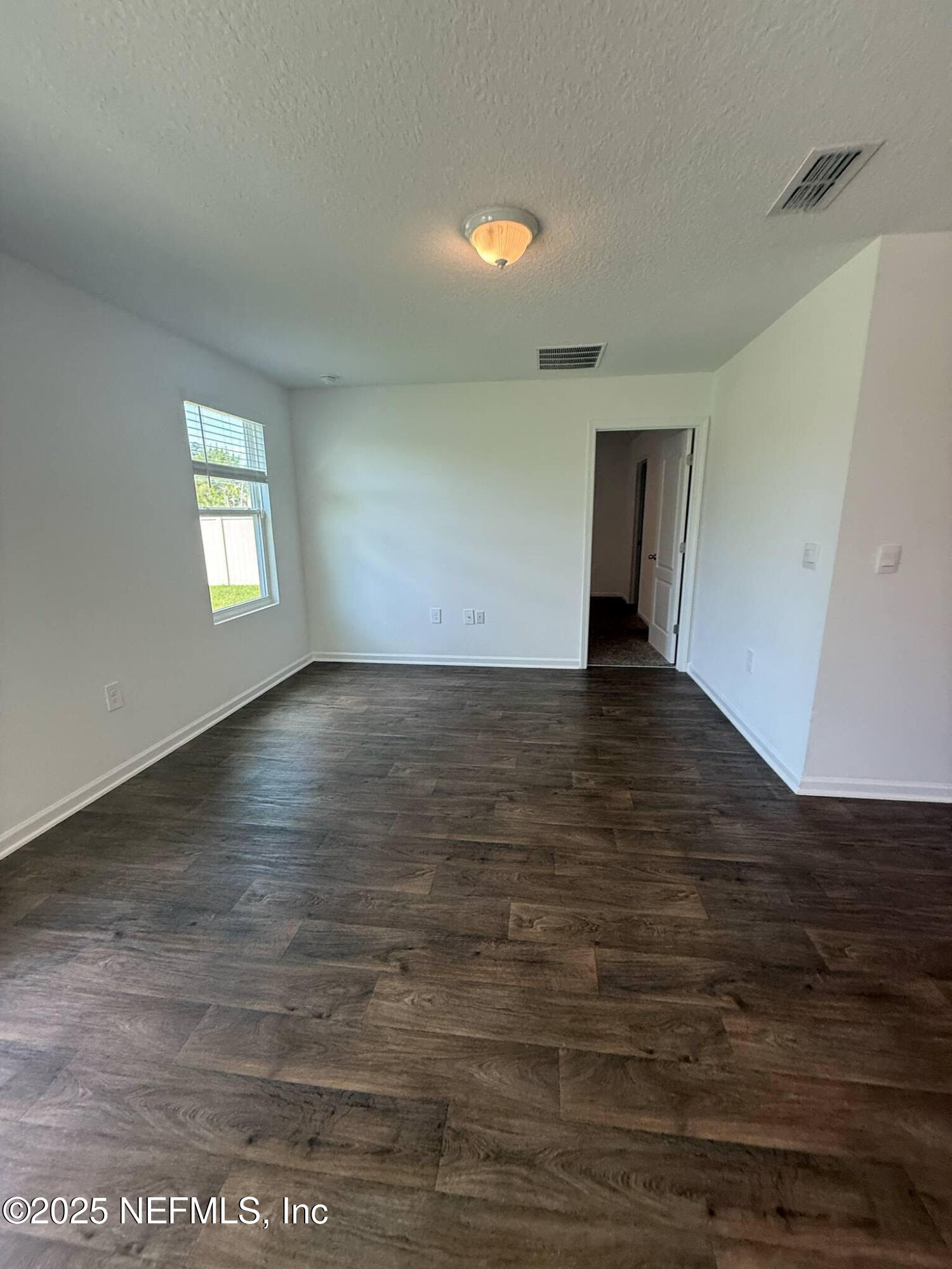 65183 Forest Glen Lane Yulee, FL 32097 - Photo 29 of 44 Living Room with Entry to Master Bedrom