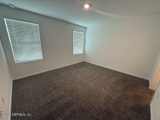 65183 Forest Glen Lane Yulee, FL 32097 - Photo 36 of 44 an empty room with windows