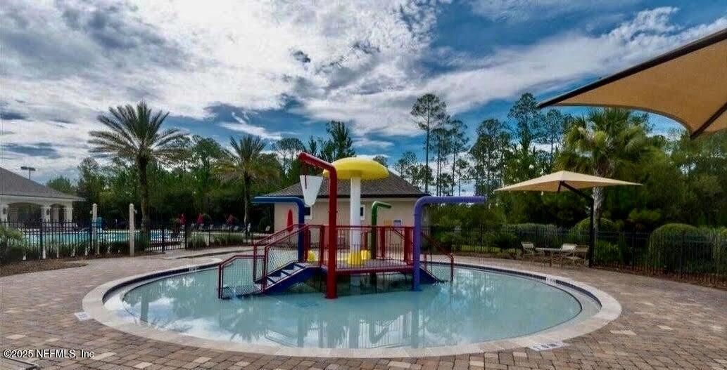 65183 Forest Glen Lane Yulee, FL 32097 - Photo 7 of 44 a view of outdoor space swimming pool and seating