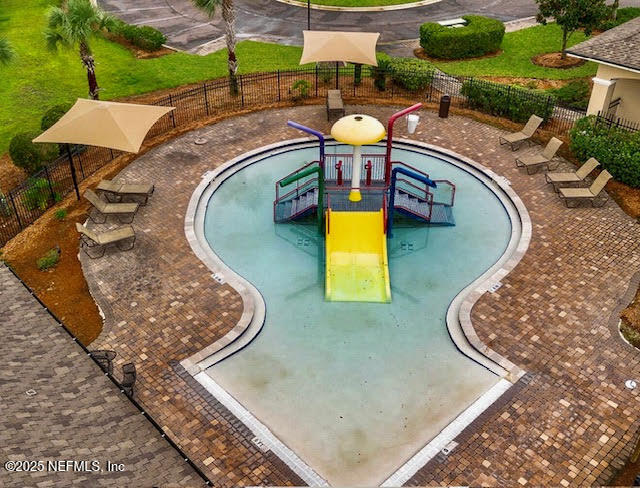 65183 Forest Glen Lane Yulee, FL 32097 - Photo 8 of 44 a view of a swimming pool with a patio