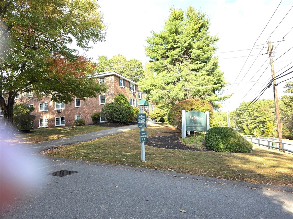 a view of a street with houses on both side