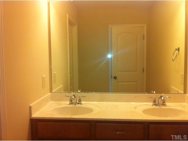 4139 Davis Meadow Street Raleigh, NC 27616 - Photo 16 of 25 Hall Bath with double cultured marble sinks and a private shower and toilette. Perfect for sharing!