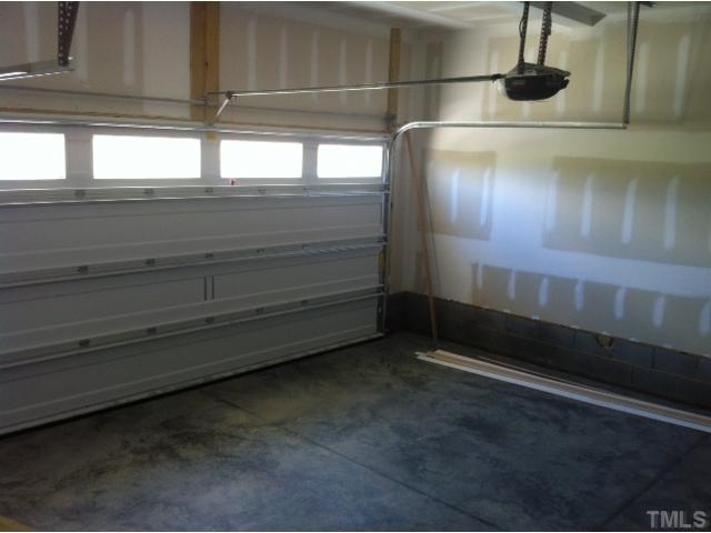 4139 Davis Meadow Street Raleigh, NC 27616 - Photo 19 of 25 Spacious garage complete with opener.