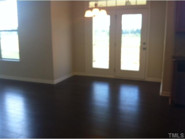 4139 Davis Meadow Street Raleigh, NC 27616 - Photo 9 of 25 Eat in kitchen looks out to the screened in porch.