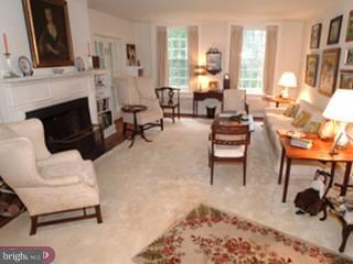 502 Chestnut Lane Wayne, PA 19087 - Photo 3 of 6 a living room with furniture and a fireplace