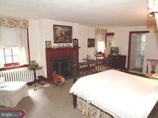 502 Chestnut Lane Wayne, PA 19087 - Photo 5 of 6 a bed room with a bed and a chair