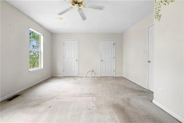 a view of an empty room with a window
