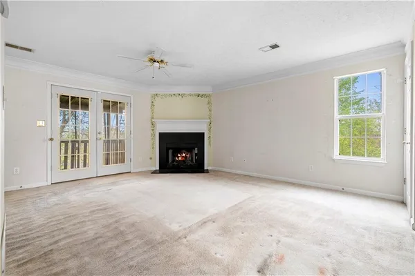 a view of an empty room with a fireplace