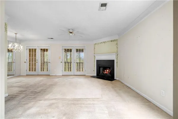 an empty room with furniture and a fireplace