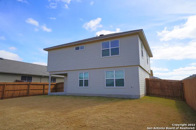a house view with a backyard space