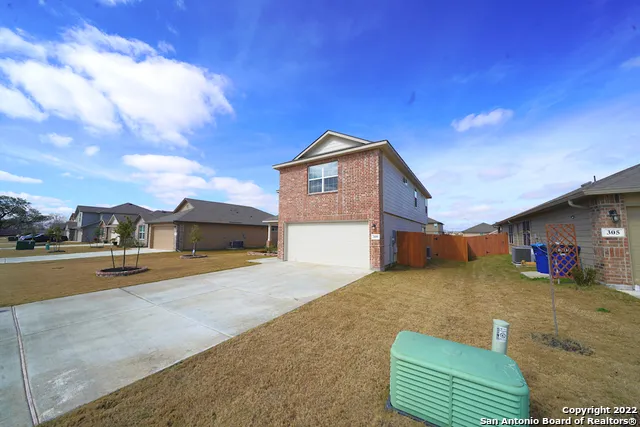 a view of a house with swimming pool and porch