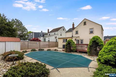 a view of a backyard with sitting area and furniture