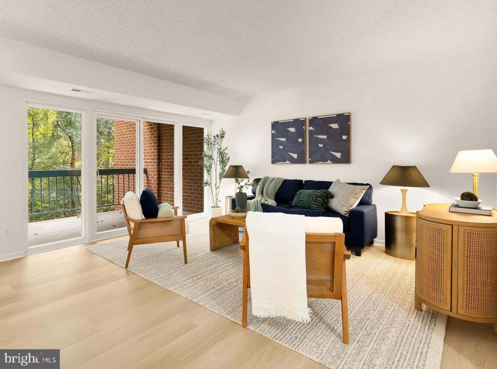 11833 Shire Court, Unit 21B Reston, VA 20191 - Photo 1 of 37 a living room with furniture and a large window