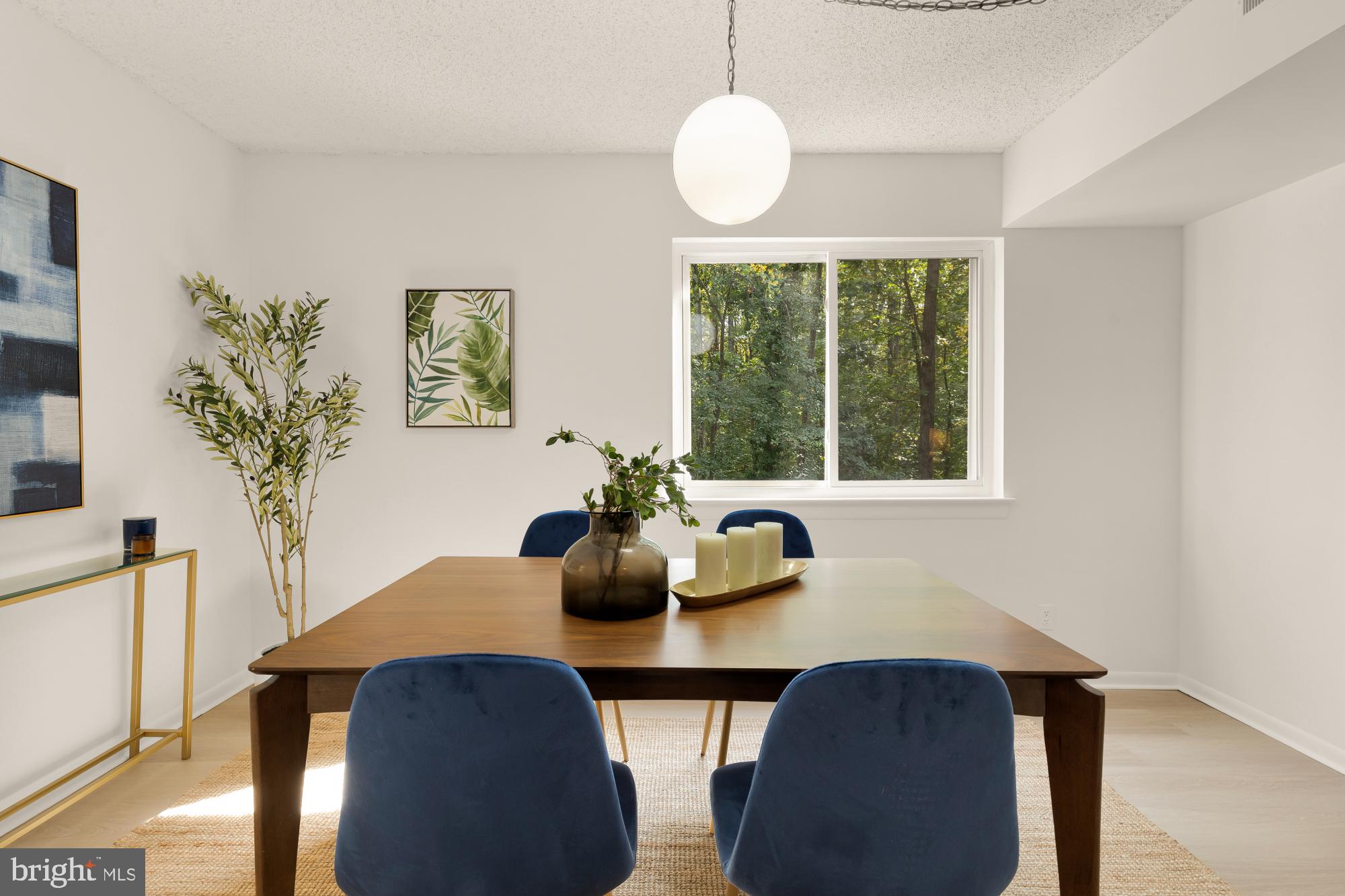 11833 Shire Court, Unit 21B Reston, VA 20191 - Photo 13 of 37 a dining room with furniture and window