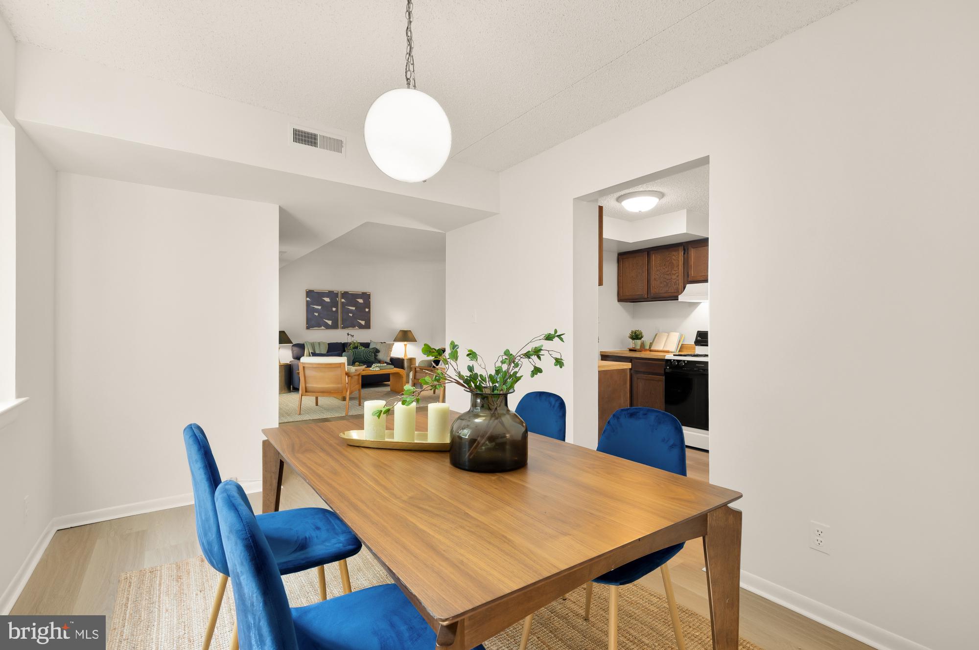 11833 Shire Court, Unit 21B Reston, VA 20191 - Photo 14 of 37 a view of a dining room with furniture and wooden floor