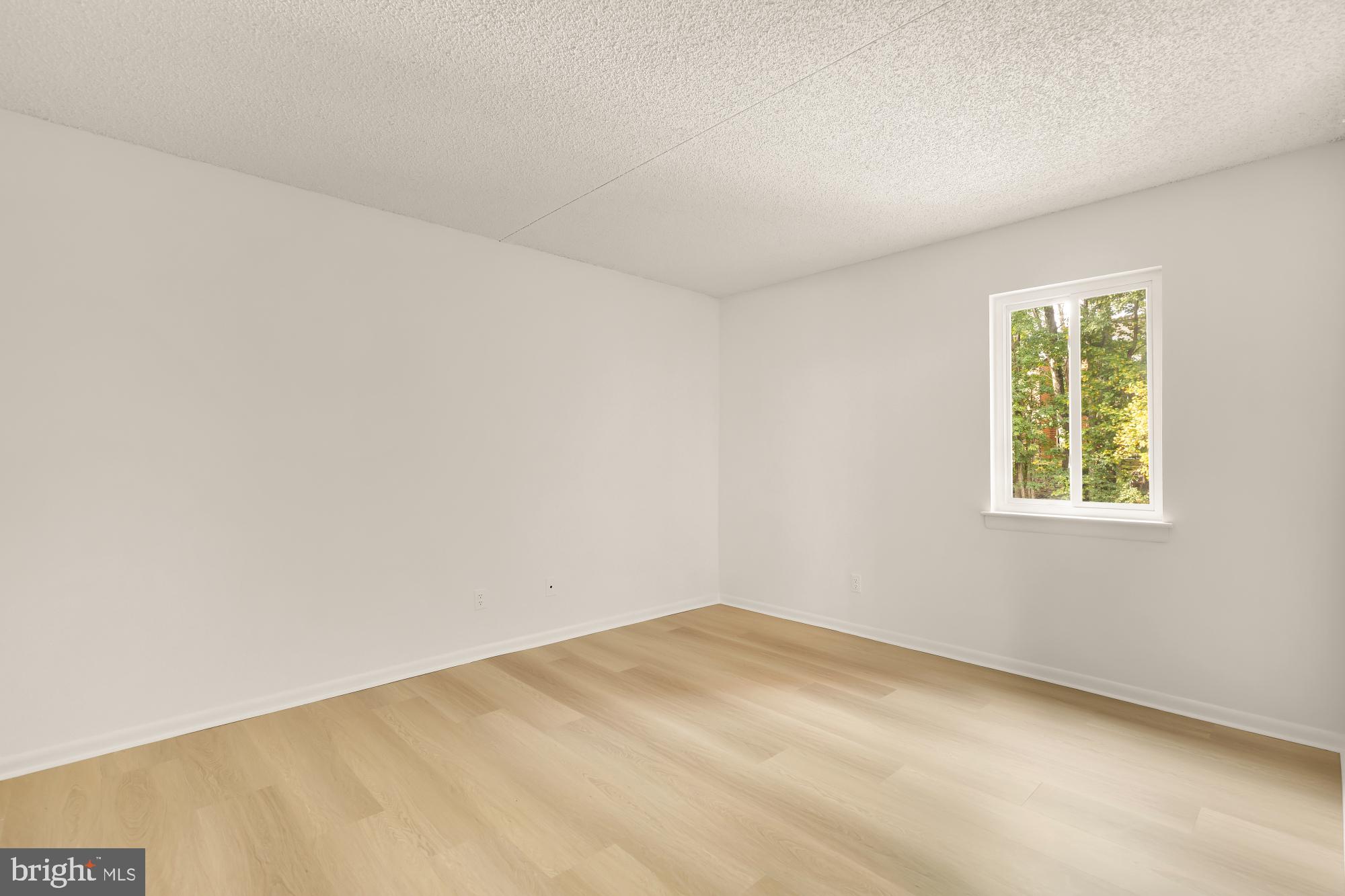 11833 Shire Court, Unit 21B Reston, VA 20191 - Photo 25 of 37 an empty room with a window