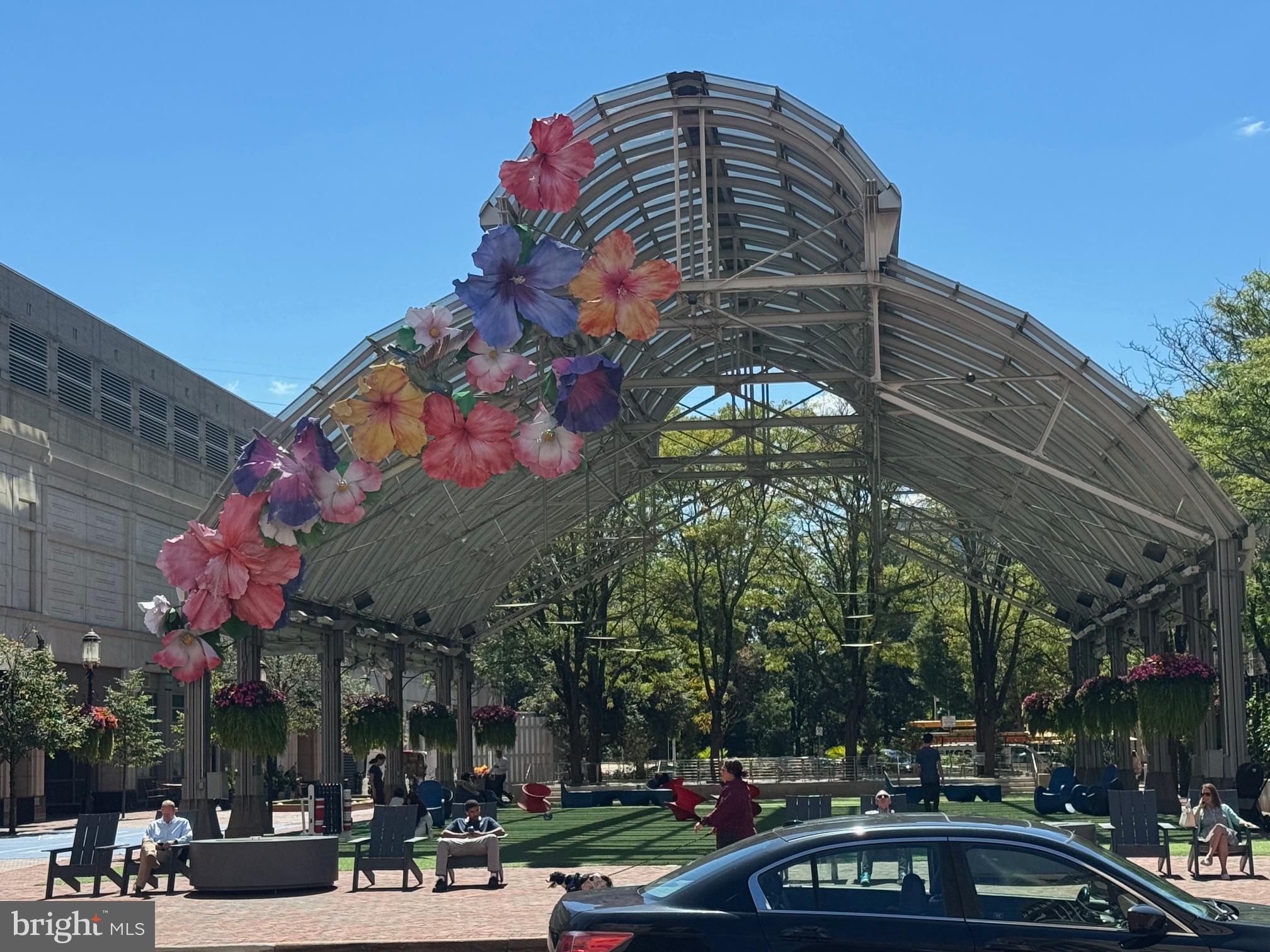 11833 Shire Court, Unit 21B Reston, VA 20191 - Photo 30 of 37 a front view of a building with lot of cars and trees