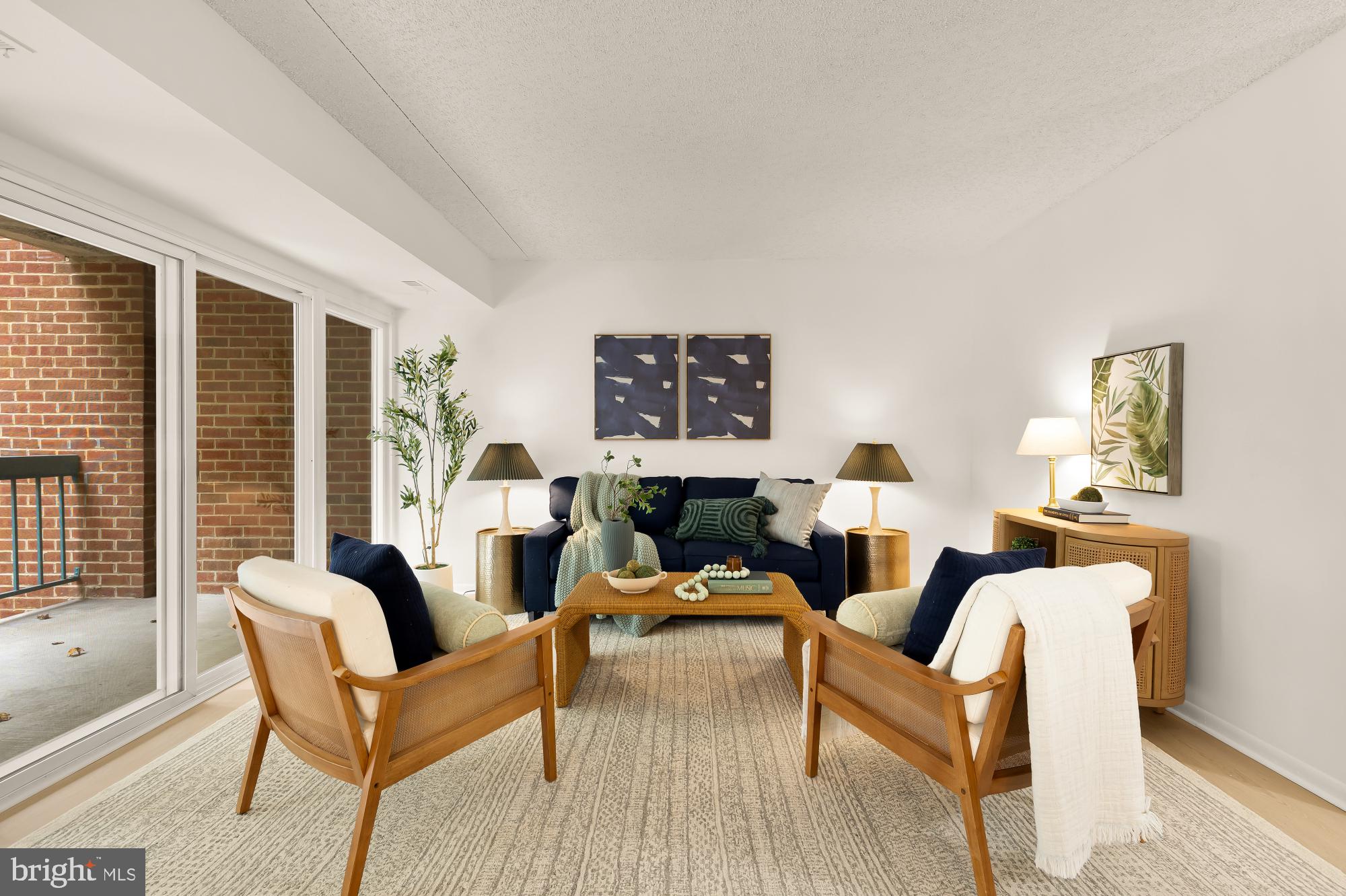 11833 Shire Court, Unit 21B Reston, VA 20191 - Photo 3 of 37 a living room with furniture and a large window