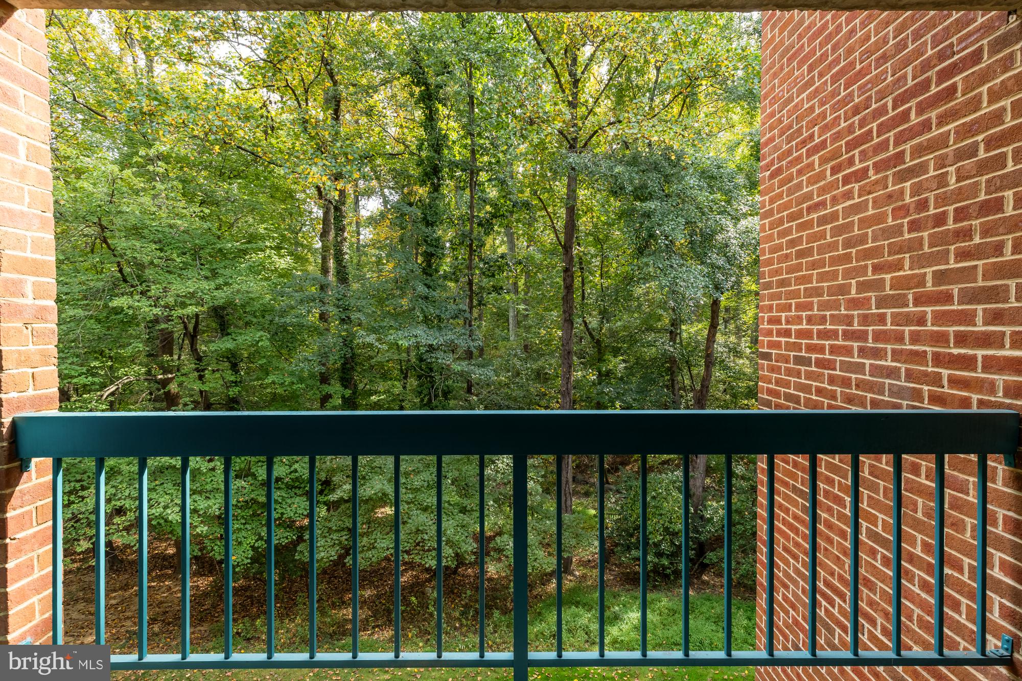 11833 Shire Court, Unit 21B Reston, VA 20191 - Photo 5 of 37 a view of a wooden fence from a window