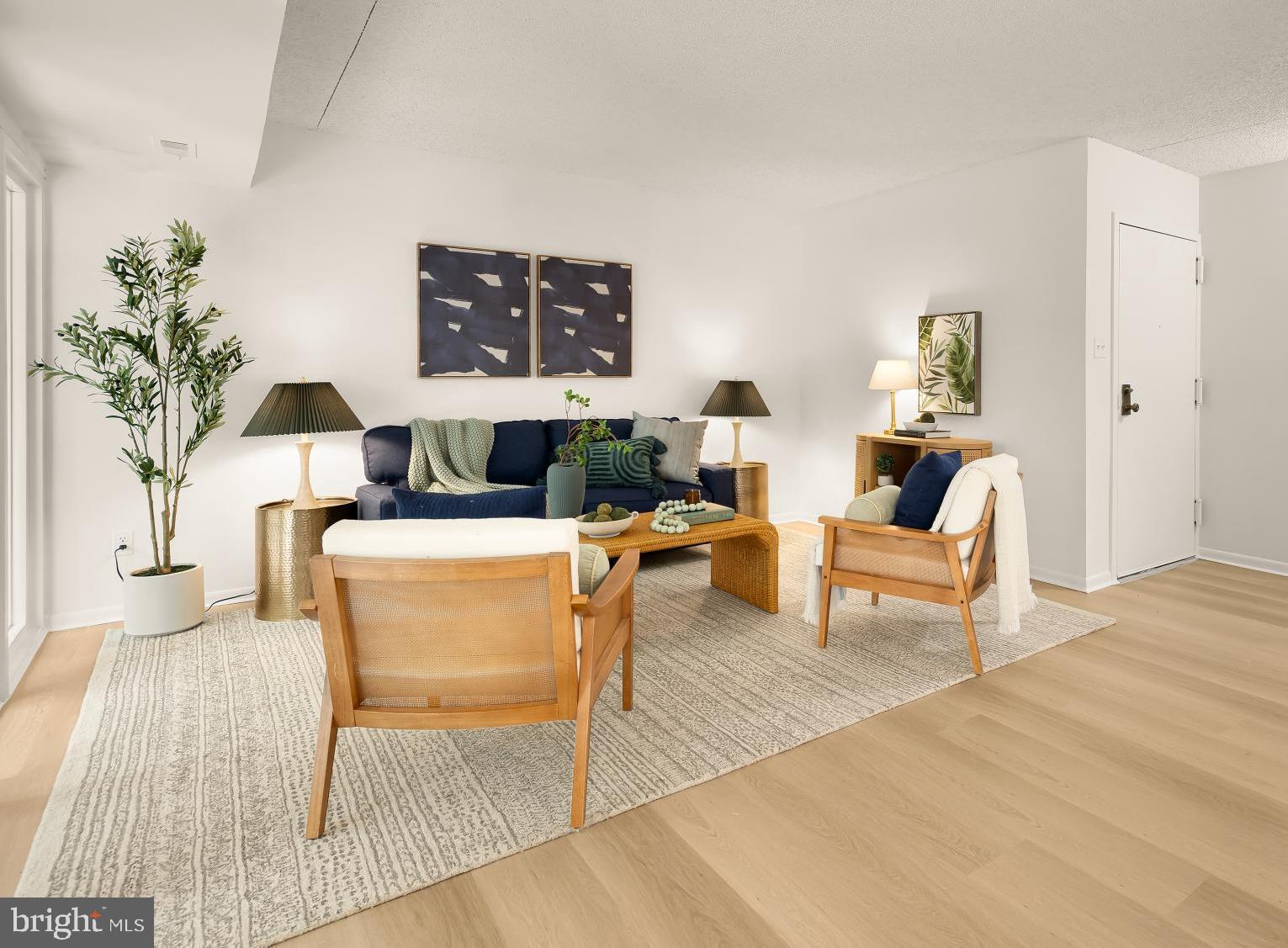 11833 Shire Court, Unit 21B Reston, VA 20191 - Photo 8 of 37 a living room with furniture and a rug