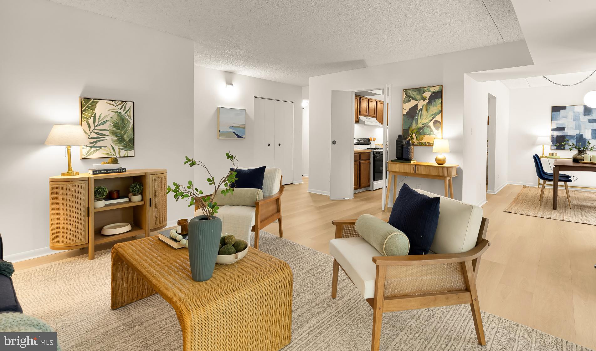11833 Shire Court, Unit 21B Reston, VA 20191 - Photo 9 of 37 a living room with fireplace furniture and a wooden floor