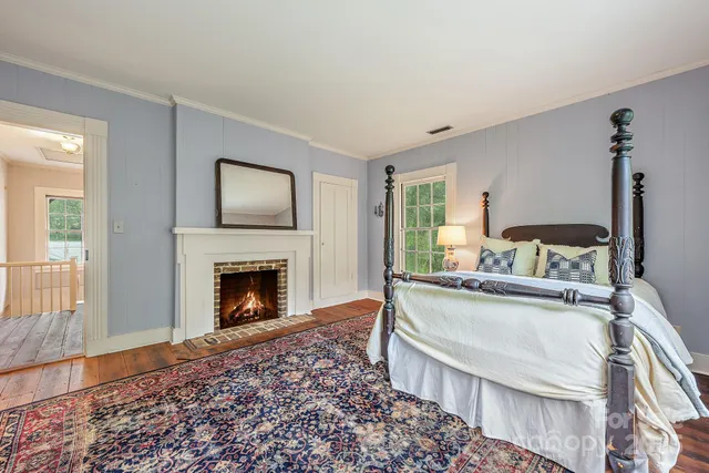 a bed room with a bed and a window