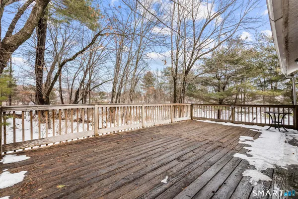 a view of wooden deck and a trees