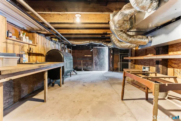 a view of garage with wooden deck