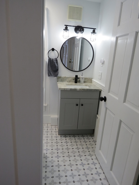7 Maple Place Winchendon, MA 01475 - Photo 14 of 22 a bathroom with a sink a mirror and vanity