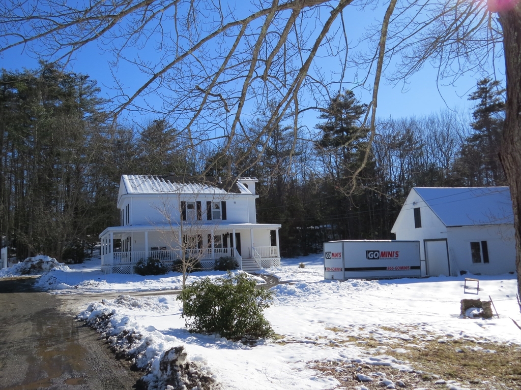 7 Maple Place Winchendon, MA 01475 - Photo 18 of 22 a front view of a house with a yard covered in snow