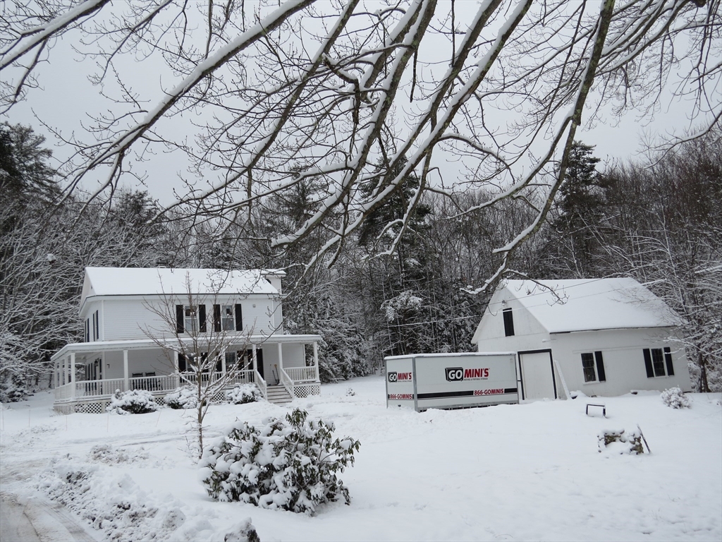 7 Maple Place Winchendon, MA 01475 - Photo 2 of 22 a view of a white house covered in snow