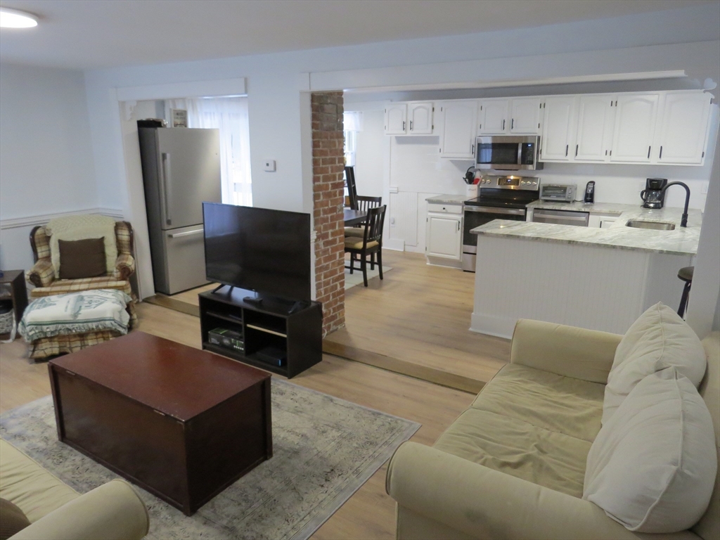7 Maple Place Winchendon, MA 01475 - Photo 6 of 22 a living room with furniture and a flat screen tv