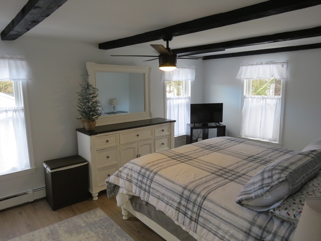 7 Maple Place Winchendon, MA 01475 - Photo 10 of 22 a bedroom with a bed and a window